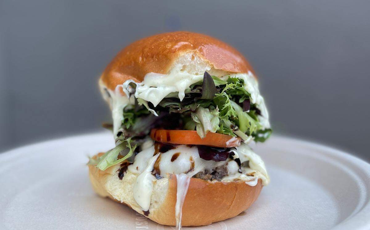 Pinky’s Westside Grill’s Duke’s Hot Tomato Summer dish is The Capri Burger, featuring double provolone cheese, tomatoes, Basil Dukes Mayo, mixed greens and a balsamic glaze.