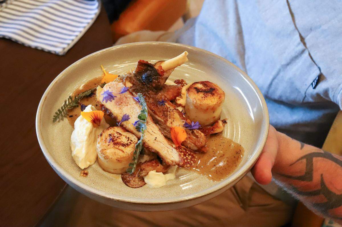Fine & Fettle’s Roasted Guinea Hen is made with Sixstone Creek guinea hen, celeriac, mushrooms, pickled mustard seed, petite greens and jus. 