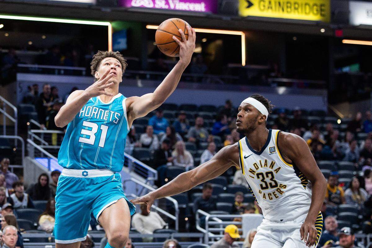 Charlotte Hornets forward Tidjane Salaun (31) shoots the ball while Indiana Pacers center Myles Turner (33) defends in the second half at Gainbridge Fieldhouse. 