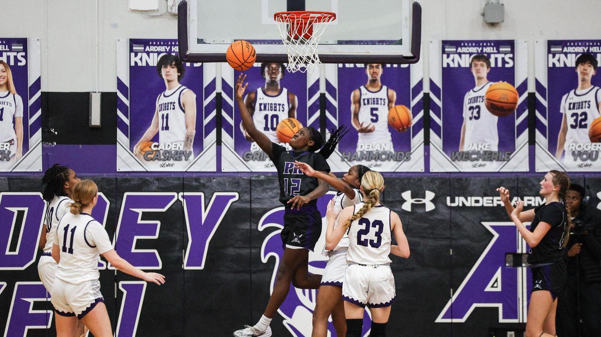 Porter Ridge’s Ashanti Taylor (12) takes the ball to the hoop during the game against Ardrey Kell’s at the Chick-Fil-A Classic at Ardrey Kell High School on Friday, December 22, 2023.