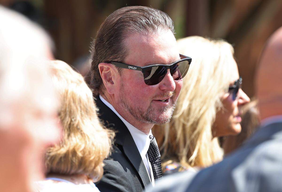 Former NASCAR driver Kurt Busch talks with other attendees following the funeral for former longtime Charlotte Motor Speedway president H.A. “Humpy” Wheeler, Jr., on Tuesday, August 26, 2025 at St. Gabriel Catholic Church in Charlotte, NC.Wheeler passed away on August 20, 2025 at the age of 86.