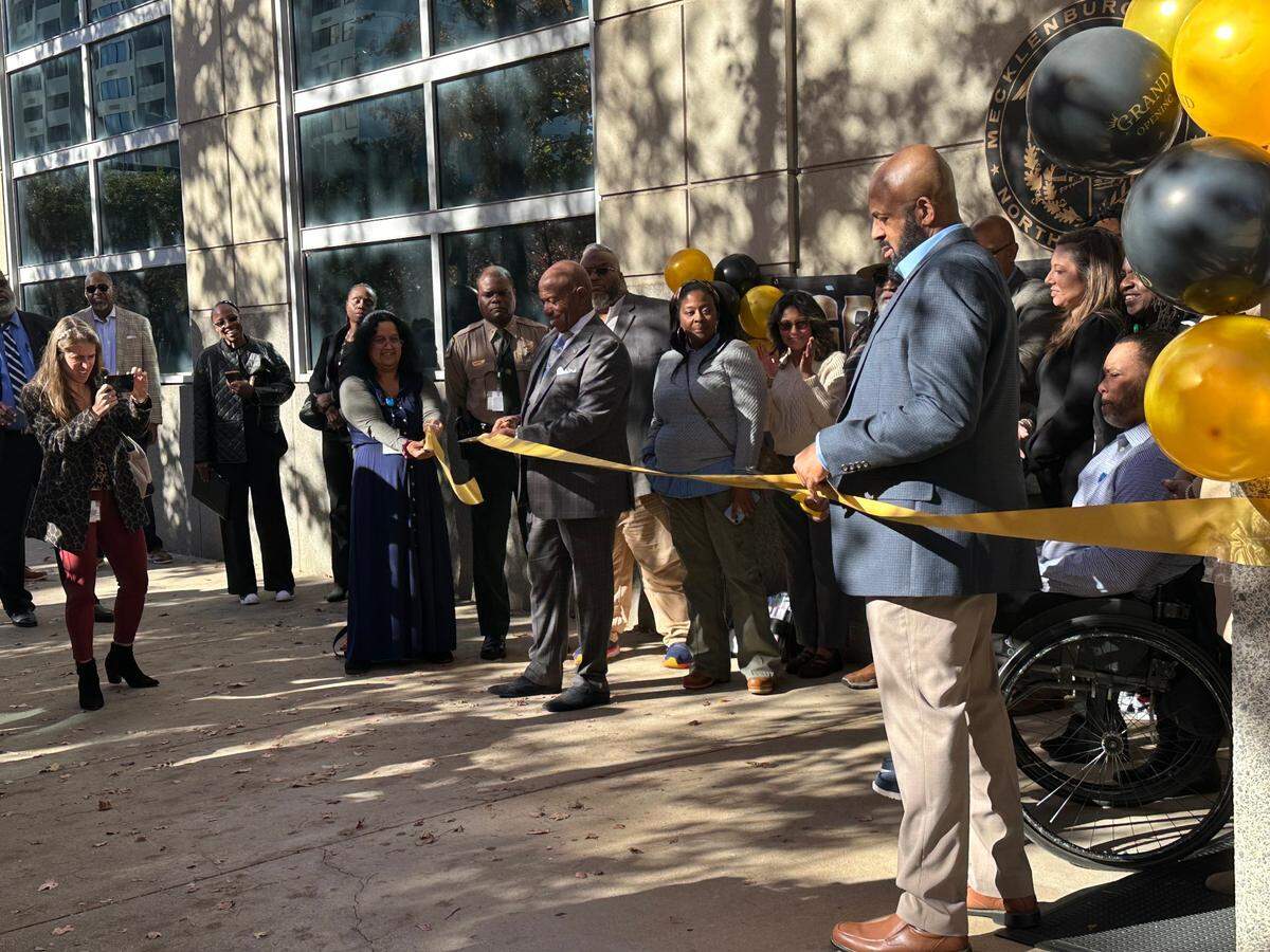 Mecklenburg County Sheriff Garry McFadden cuts the ribbon at the grand opening of the Post Release Resource Center in uptown in November.