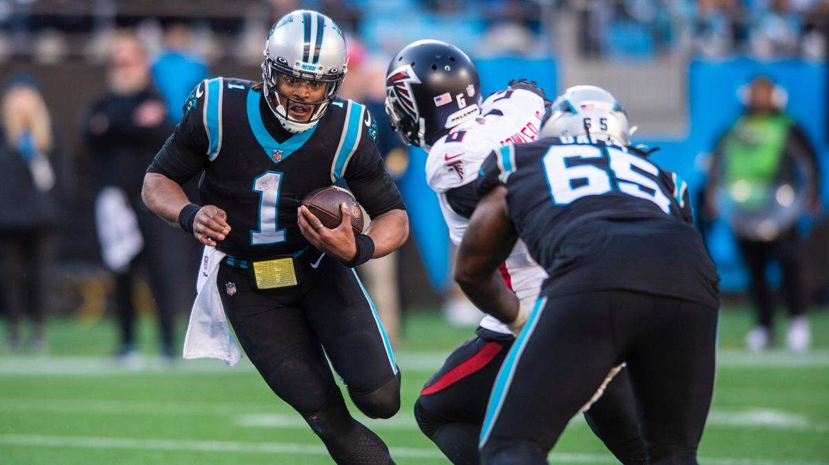 Panthers quarterback Cam Newton carries the ball on a quarterback keeper against Atlanta Sunday. Newton had two key turnovers in Carolina’s 29-21 loss, which was the Panthers’ fifth straight loss in Bank of America Stadium.