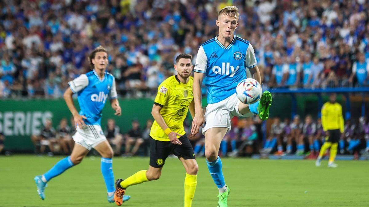 Charlotte FCs Karol Swiderski, right, extends for a kick toward a pass during the match against Chelsea FC at Bank of America Stadium on Wednesday, July 20, 2022 in Charlotte, NC. Swiderski has expressed interest in returning to Charlotte FC for Year 2.