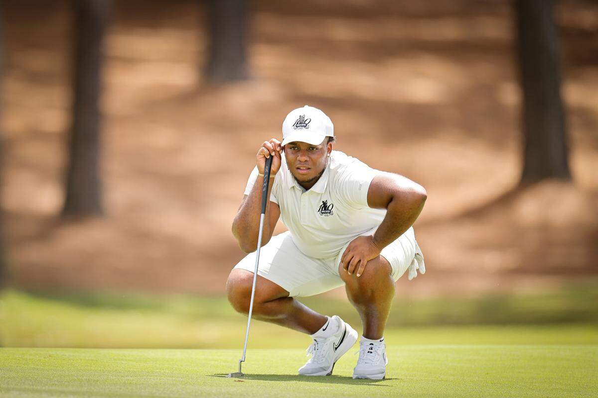 Florida A&M’s Troy Stribling lines up a shot on the second green during the Charlie Sifford Centennial Cup at Quail Hollow Club in Charlotte, N.C., Monday, Aug. 29, 2022.