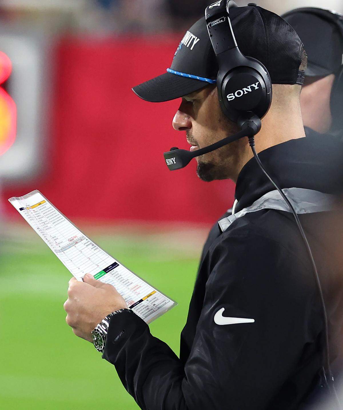 Carolina Panthers head coach Dave Canales looks over his play sheet during action against the Tampa Bay Buccaneers on Jan. 3, 2026, at Raymond James Stadium in Tampa, Fla. The Buccaneers defeated the Panthers 16-14.