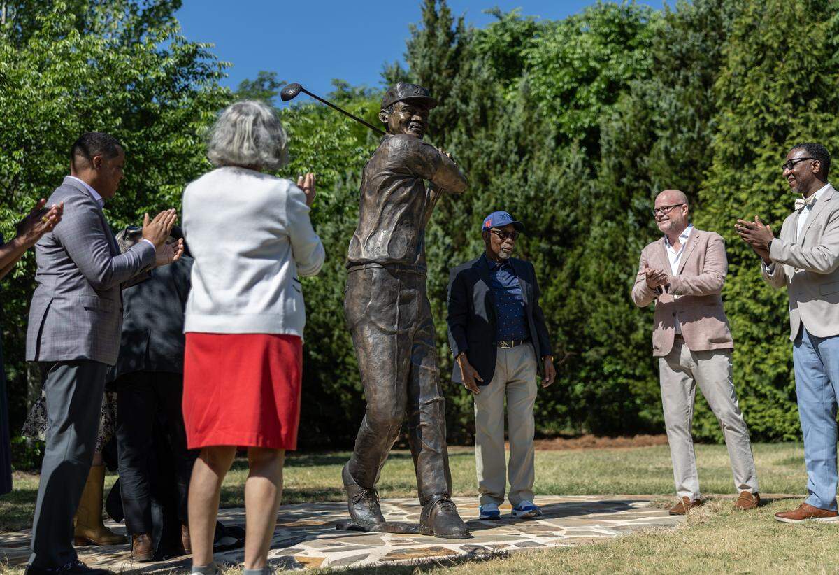 Dr. Charles Sifford’s family reacts to the unveiling of a commemorative statue honoring Dr. Charles Sifford, a Charlotte native and the PGA TOUR’s first Black member at Elizabeth Park in Charlotte, N.C., on Tuesday, May 5, 2026, in an event sponsored by the Truist Championship, in partnership with the Charlotte Trail of History.