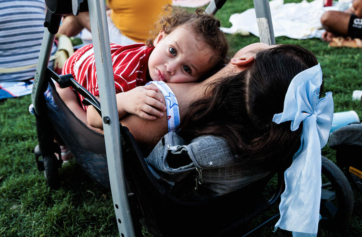 Samuel Sanchez, 1, (left) and Angela Sanchez, 8, wait for the fireworks to begin on Saturday July 4, 2026 at Romare Bearden Park.