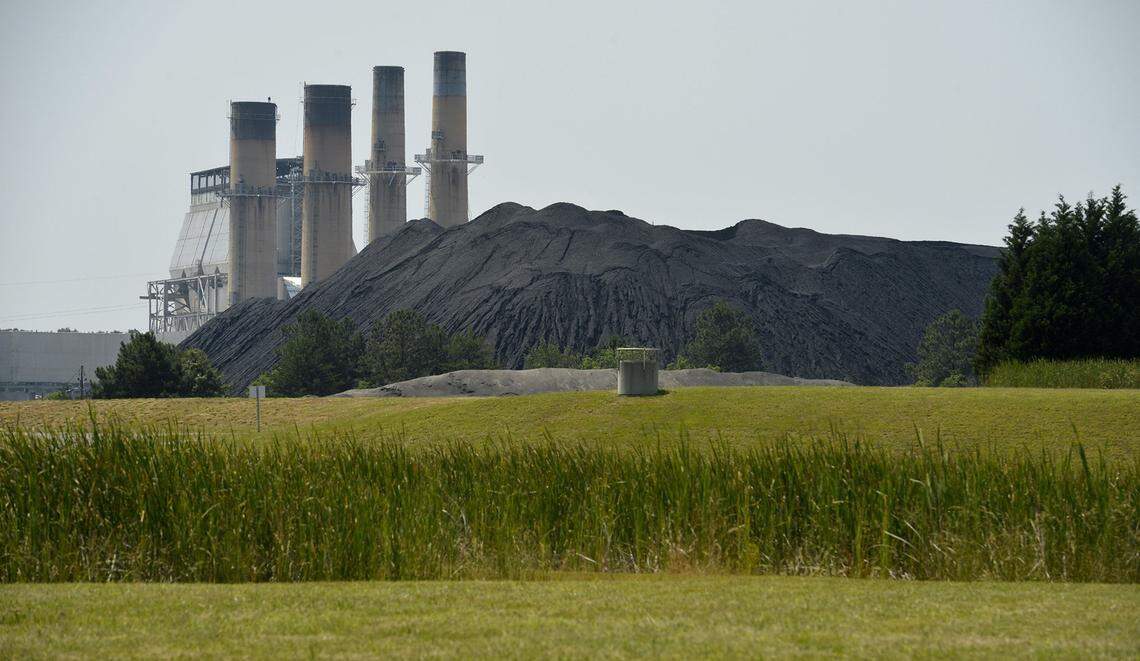 In 2018, Duke Energy announced that it would close its seven N.C. coal plants over the next 30 years. This 2016 photo shows a mountain of coal next to Duke Energy’s Marshall Steam Station on Lake Norman. Critics say the N.C. Utilities Commission’s new Carbon Plan gives deferential treatment to Duke Energy.