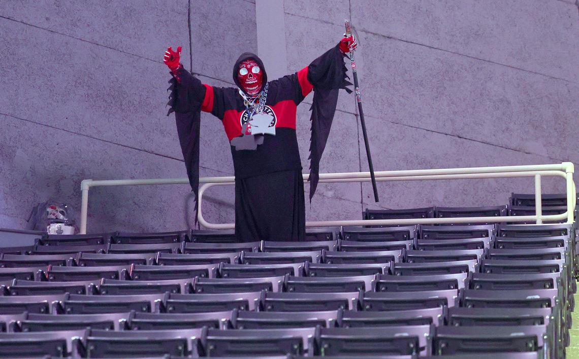 The Carolina Reaper aka. Kevin Weiker makes his way to his seat prior to the Charlotte Checkers game against the Cleveland Monsters at Bojangles Coliseum in Charlotte, NC on Friday, October 18, 2024.