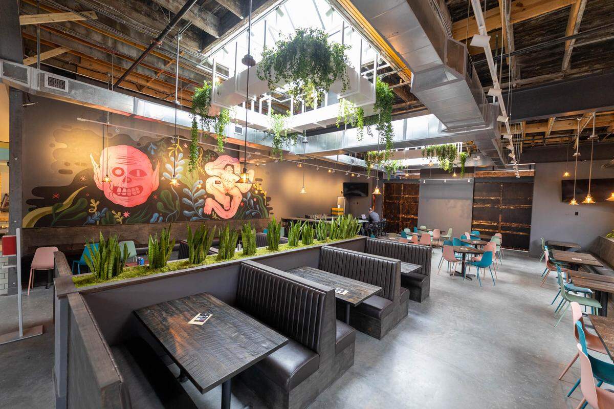 The El Toro Bruto side of Resident Culture in South End has extra seating and natural light. The spaces were created in collaboration with Liles Construction as the general contractor, Cluck Design Collaborative as the architect and Maryssa Pickett, who creates Resident Culture’s artwork.