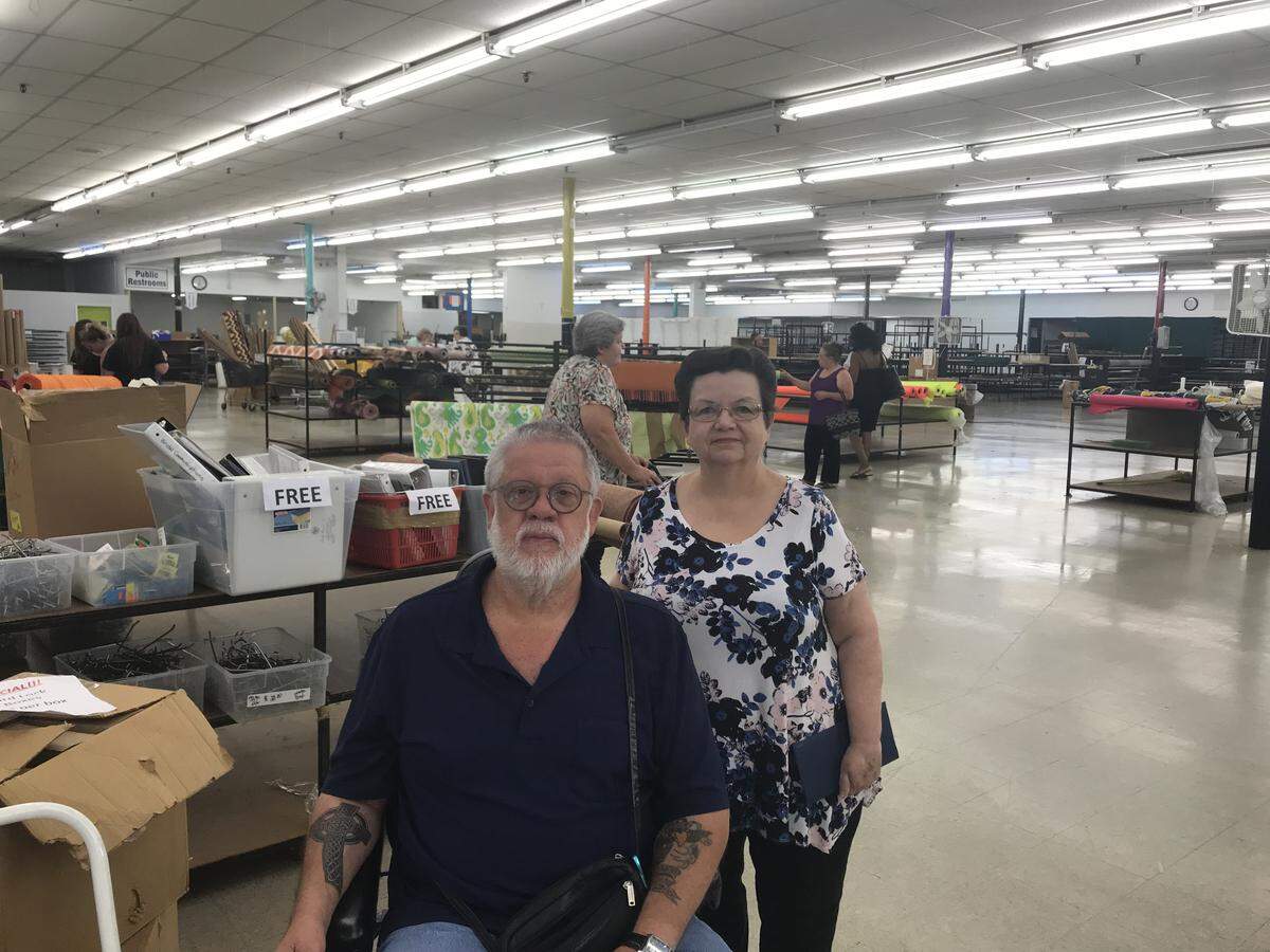 Thomas Cloninger, whose mother started Mary Jo’s Cloth Store in 1951 and grew the business into a regional landmark, prepares to close the Gastonia shop later this week. He is with his wife, Betty.