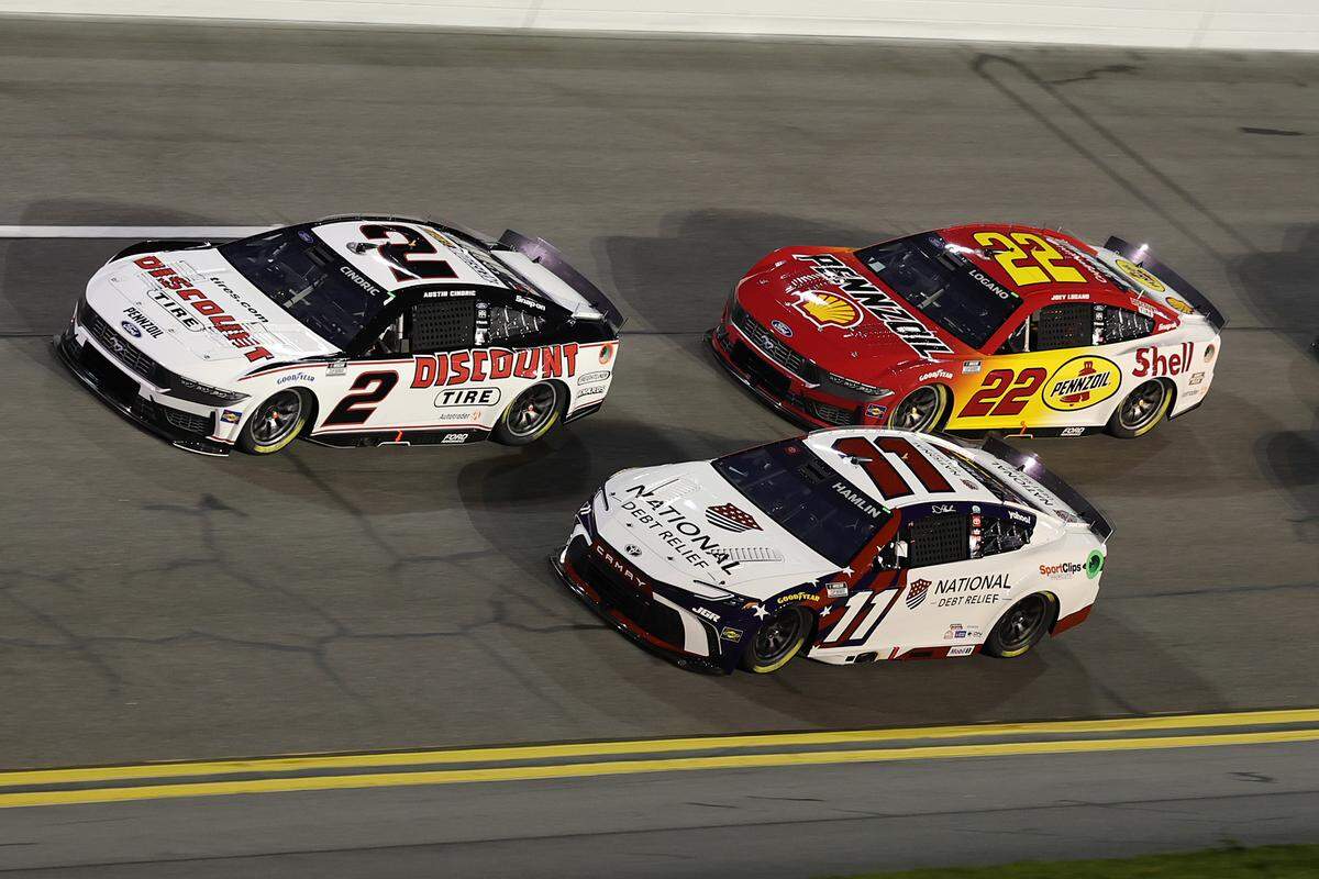 NASCAR Cup Series driver Austin Cindric (2) leads driver Denny Hamlin (11) during Duel 2 at Daytona International Speedway.