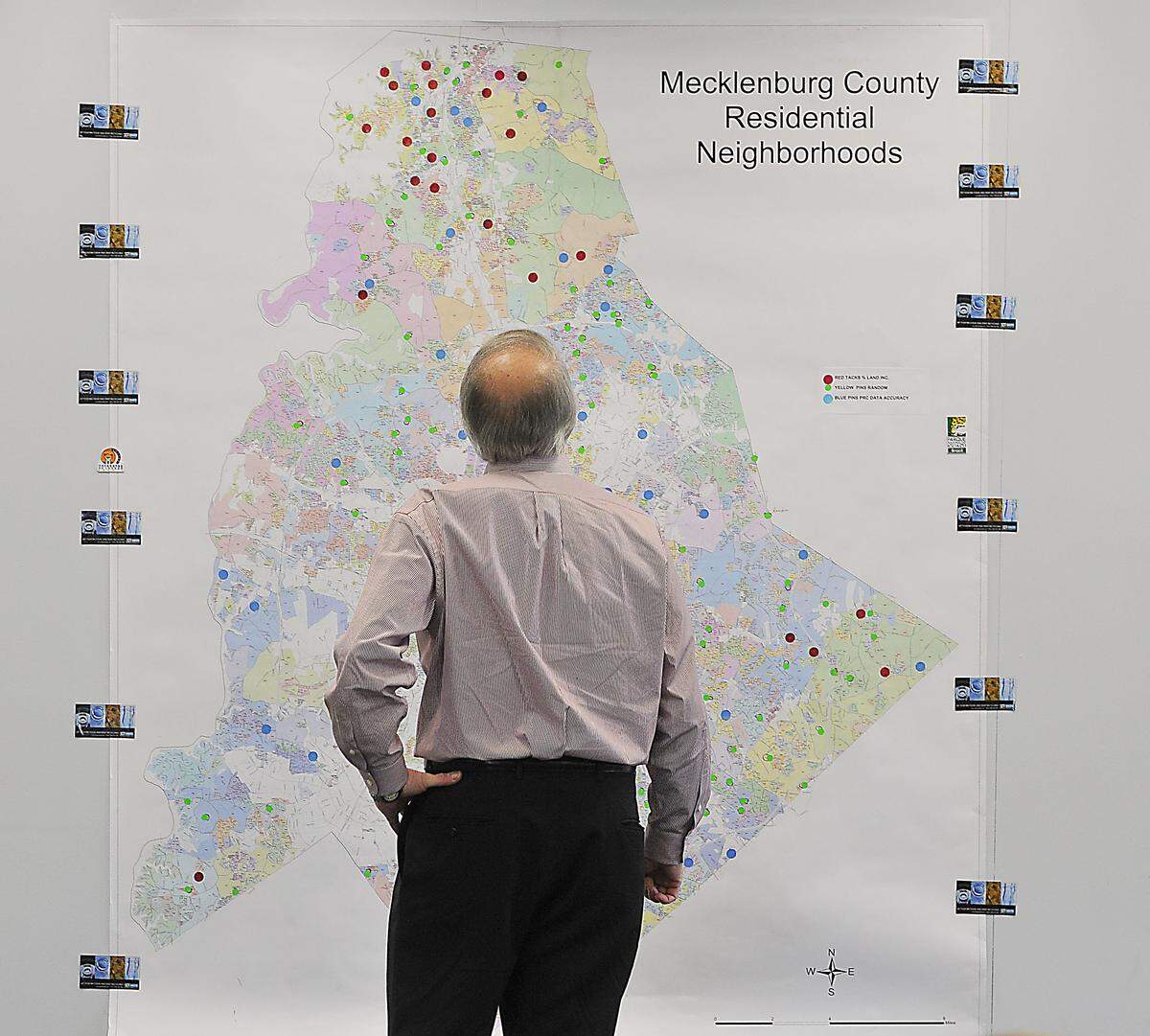 Committee member David Fuller views a map during a presentation from consultants about the 2011 revaluation review project. Mecklenburg County is conducting its first revaluation since the botched 2011 process, and property owners will get their new valuations in January.