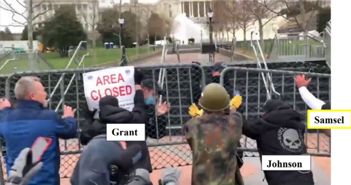 James Grant, 29, of Cary storms a security fence outside the U.S. Capitol on Jan. 6, 2021, as police try to keep him and other rioters out. Grant faces seven charges linked to the violence. On Tuesday, a judge in Washington ordered Grant returned to federal custody following his Wake County DUI arrest on Dec. 7.