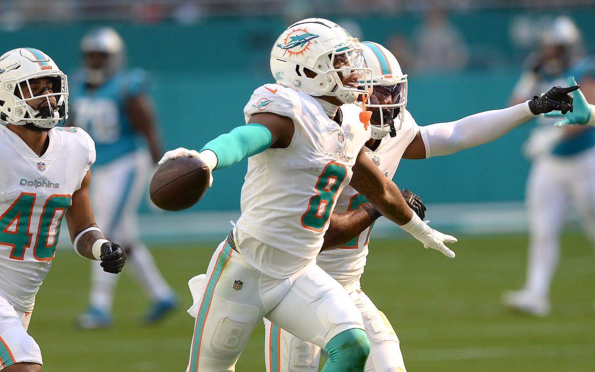 Miami Dolphins safety Jevon Holland celebrates his interception of a pass by Carolina Panthers quarterback Cam Newton meant for wide receiver Robby Anderson during second quarter action at Hard Rock Stadium in Miami Gardens, Fla. on Sunday, November 28, 2021.