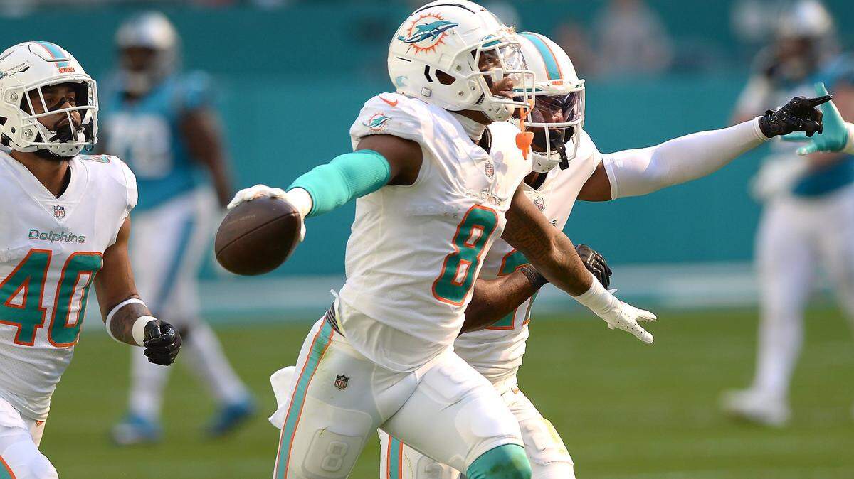 Miami Dolphins safety Jevon Holland celebrates his interception of a pass by Carolina Panthers quarterback Cam Newton meant for wide receiver Robby Anderson during second quarter action at Hard Rock Stadium in Miami Gardens, Fla. on Sunday, November 28, 2021.