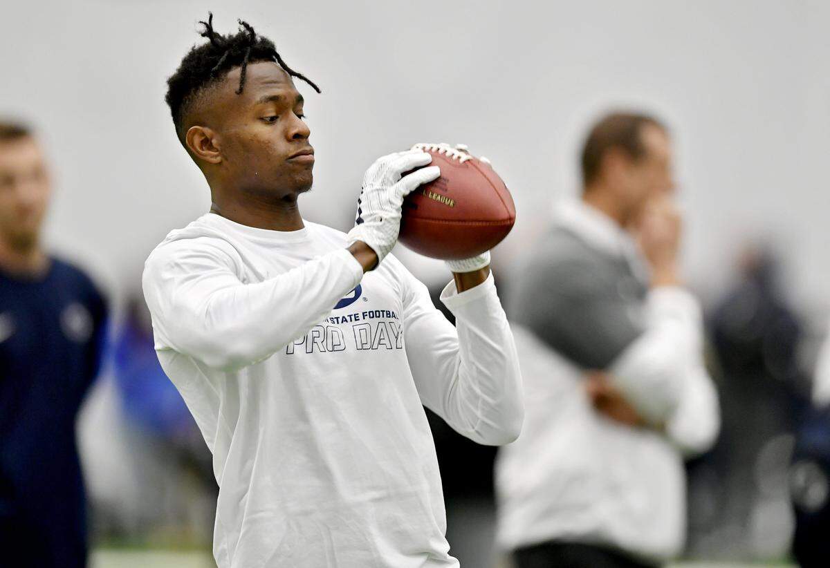 Former Penn State wide receiver DaeSean Hamilton makes a catch as he warms up to run routes during Penn State Pro Day on Tuesday, March 20, 2018, in Holuba Hall. Several Panthers personnel were in attendance, and a source told the Observer that receivers coach Lance Taylor flew out a day prior to spend time with Hamilton. (Abby Drey, Centre Daily Times)