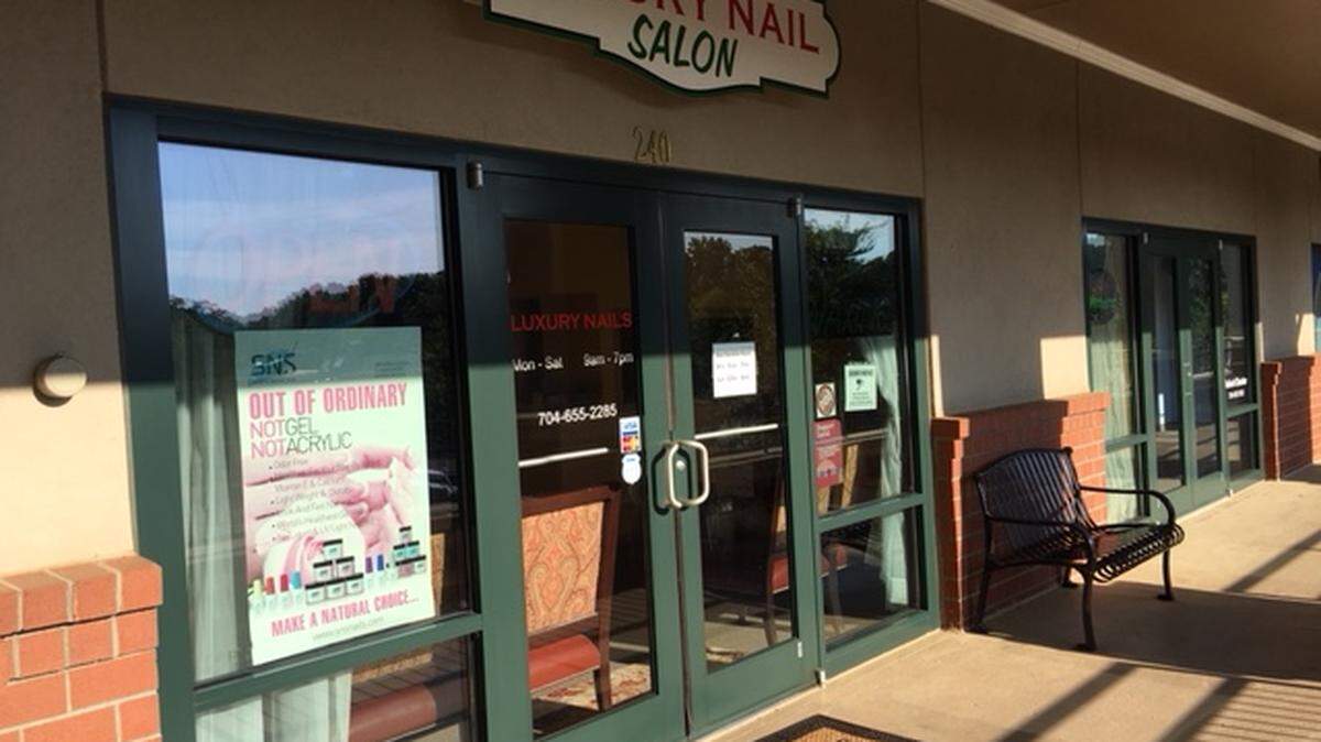 The two people arrested from a Davidson nail salon on human trafficking charges had been abusing a victim for months, arrest warrants allege. The duo allegedly stabbed the victim with tools, causing permanent scars.