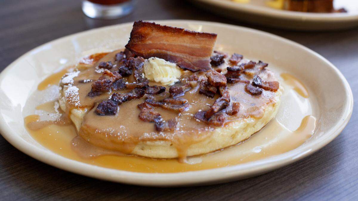 Snooze, an A.M. Eatery, based in Colorado, takes its pancakes up a notch with Tender Belly bacon crumble. A third store is opening in Charlotte in SouthPark.