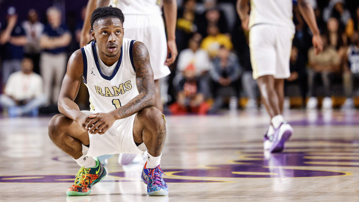 Reidsville point guard Dionte Neal (1) glances up at the scoreboard as he waits to take a free throw during the second half of the NCHSAA 4-A Eastern Regional Basketball Championship game with Washington at Eastern Carolina University in Greenville, N.C., on Saturday, March 7, 2026.
