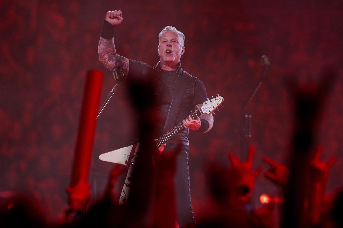 Metallica’s James Hetfield raises his fist into the air while performing at Bank of America Stadium in Charlotte, NC on Saturday, May 31, 2025.