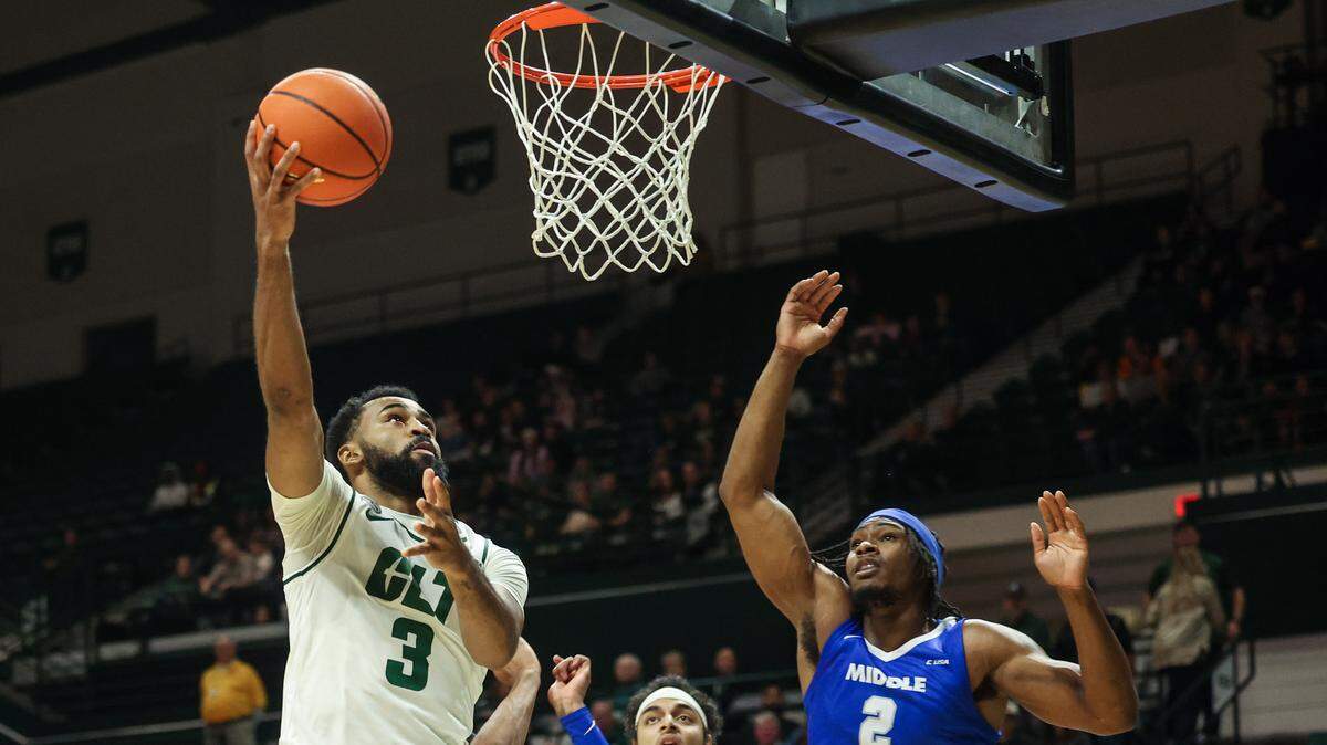 UNC Charlotte’s guard Brice Williams, left, shoots for two points during the game against Middle Tennessee at Dale F. Halton Arena on Thursday, December 29, 2022.