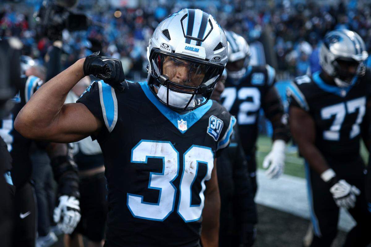Chuba Hubbard of the Carolina Panthers reacts after rushing for the game-winning touchdown during overtime of a 2024 game against the Arizona Cardinals at Bank of America Stadium.
