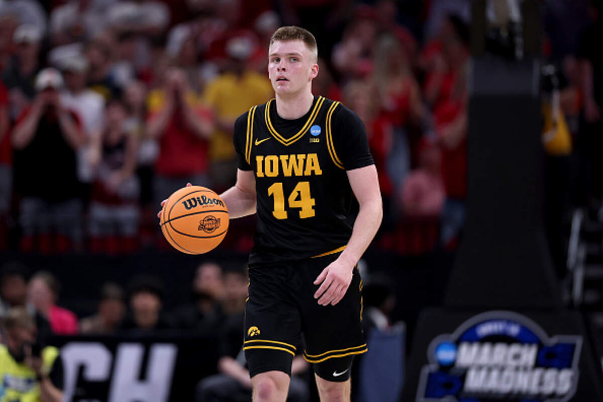 Bennett Stirtz of the Iowa Hawkeyes dribbles against the Nebraska Cornhuskers during the first half in the Sweet Sixteen of the 2026 NCAA Men's Basketball Tournament at Toyota Center.
