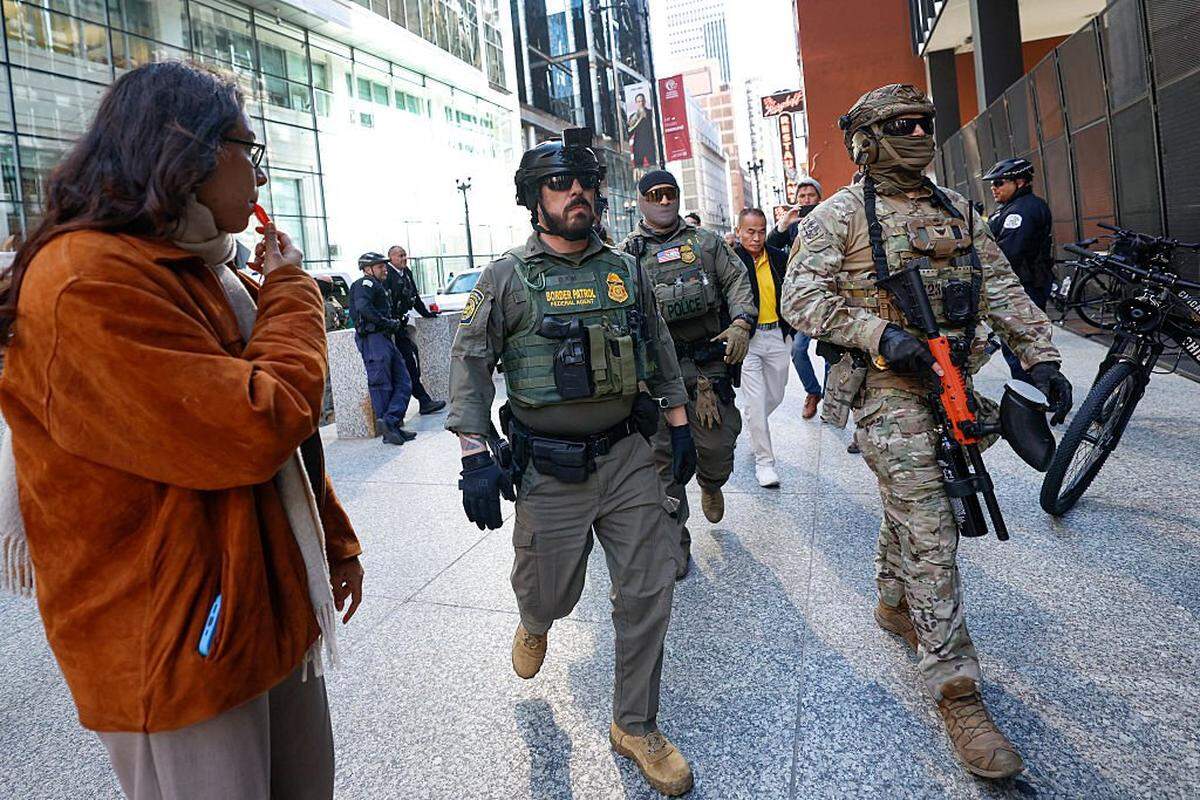 Federal agents arrive at the Dirksen Federal Building to pick up US Customs and Border Patrol Commander Gregory Bovino after his hearing at federal court in Chicago, Illinois, on October 28, 2025. Bovino was ordered to appear in federal court for violating a temporary restraining order issued by District Judge Sara Ellis that orders immigration enforcement agents to limit use of tear gas and other crowd-suppression items except when there is an imminent threat. 