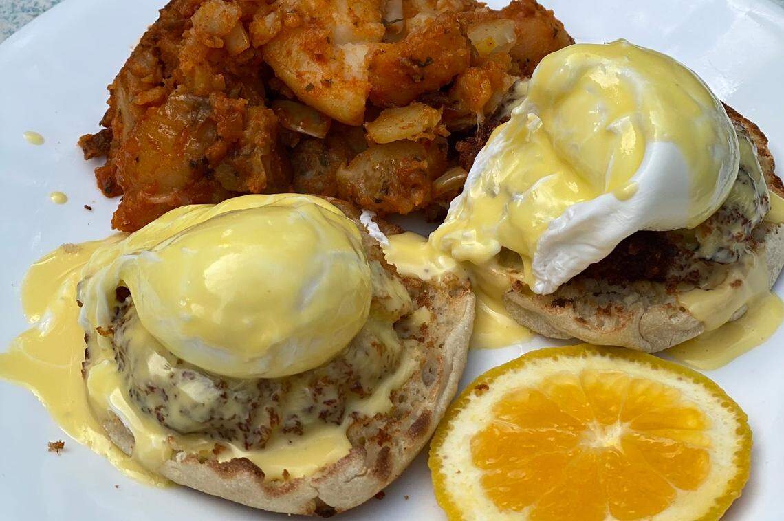The Neighborhood Café’s crab cake benedict, served with home fries.