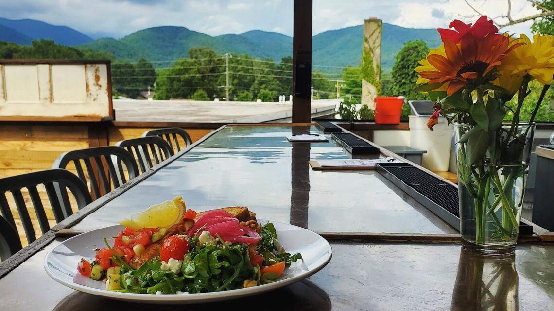 The Bell Tower Black Mountain is a rooftop bar featuring craft cocktails, mocktails, local beer, wine, small plates and desserts.