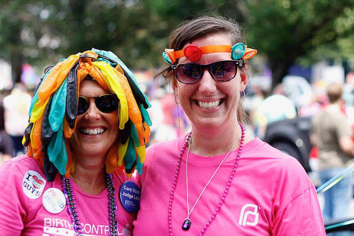 Marcie Shealy and a colleague pose at a protest in what Shealy calls “condom couture.”