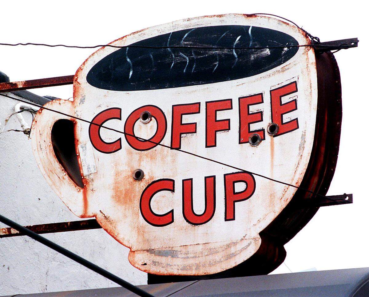 A picture of The Coffee Cup’s sign is shown in July 1999.
