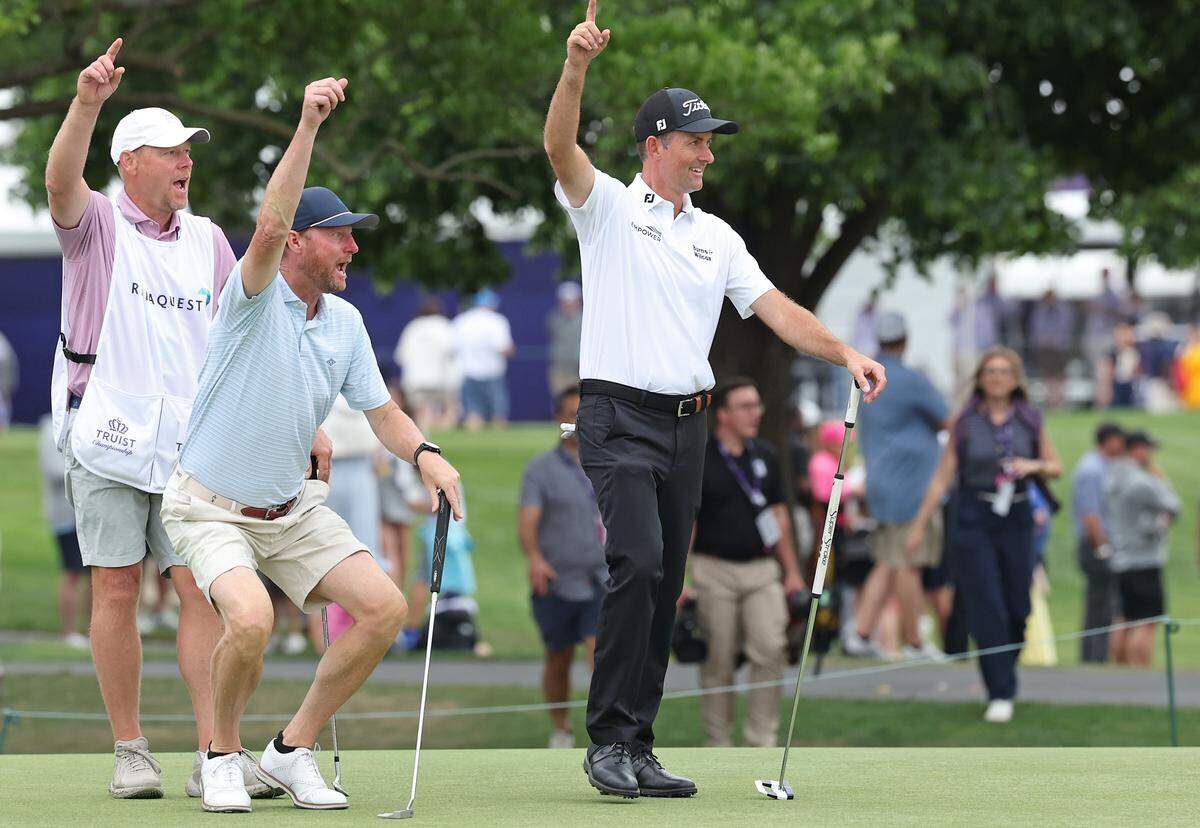 Golfer Webb Simpson, right, and members of his amateur team react to one player’s sinking a putt on the ninth green during the Truist Championship Pro-Am at Quail Hollow Club in Charlotte, NC on Wednesday, May 6, 2026. 