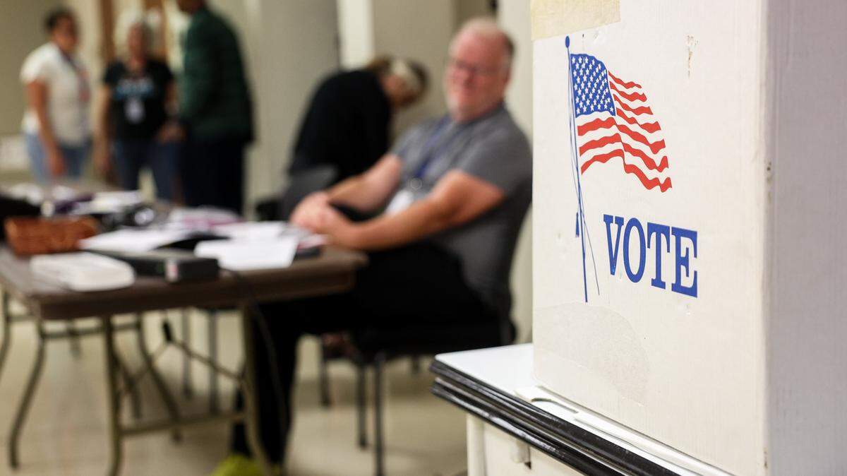 Election workers wait for voters at Sharon Presbyterian Church in south Charlotte during the primary election on Tuesday, September 9, 2025.