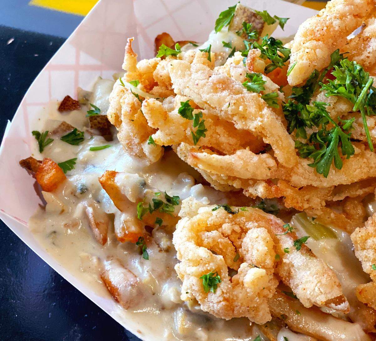 What The Fries has a new dish: Clam Chowder Fries: Hand-cut fries topped with house-made clam chowder and crispy clams. $16