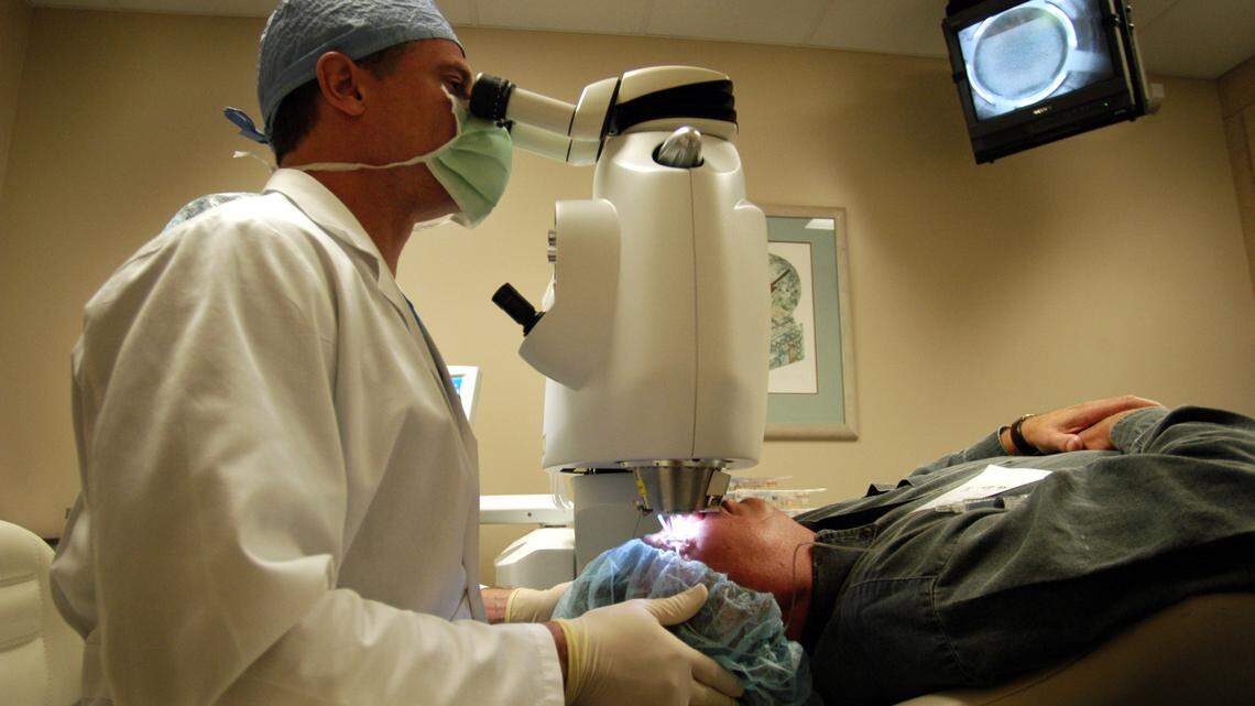 Jonathan Christenbury performs eye surgery on a patient in 2003. The former south Charlotte doctor died of a heart attack at his home on Friday, July 19, 2019. He was 64.