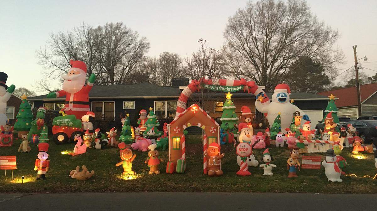 The Carroll family set up their record number of holiday inflatable decorations this year, 86, at their home on Wilhelmina Avenue in Plaza Midwood.