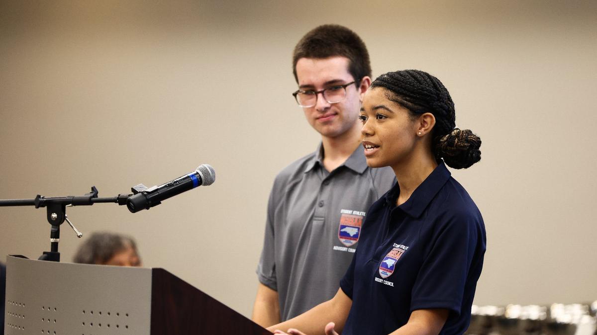 CHARLOTTE, NC - SEPTEMBER 16: Amor Morris (right) of Providence High School and Marco Zamudio (left) of Hough High School speak on behalf of the Student-Athlete Advisory Council at The NCHSAA Regional Meeting at Cabarrus Arena in Cabarrus, NC on September 16, 2024. The student-athletes spoke on the importance of student advocate groups and how to further develop student athletes at their respective programs.
