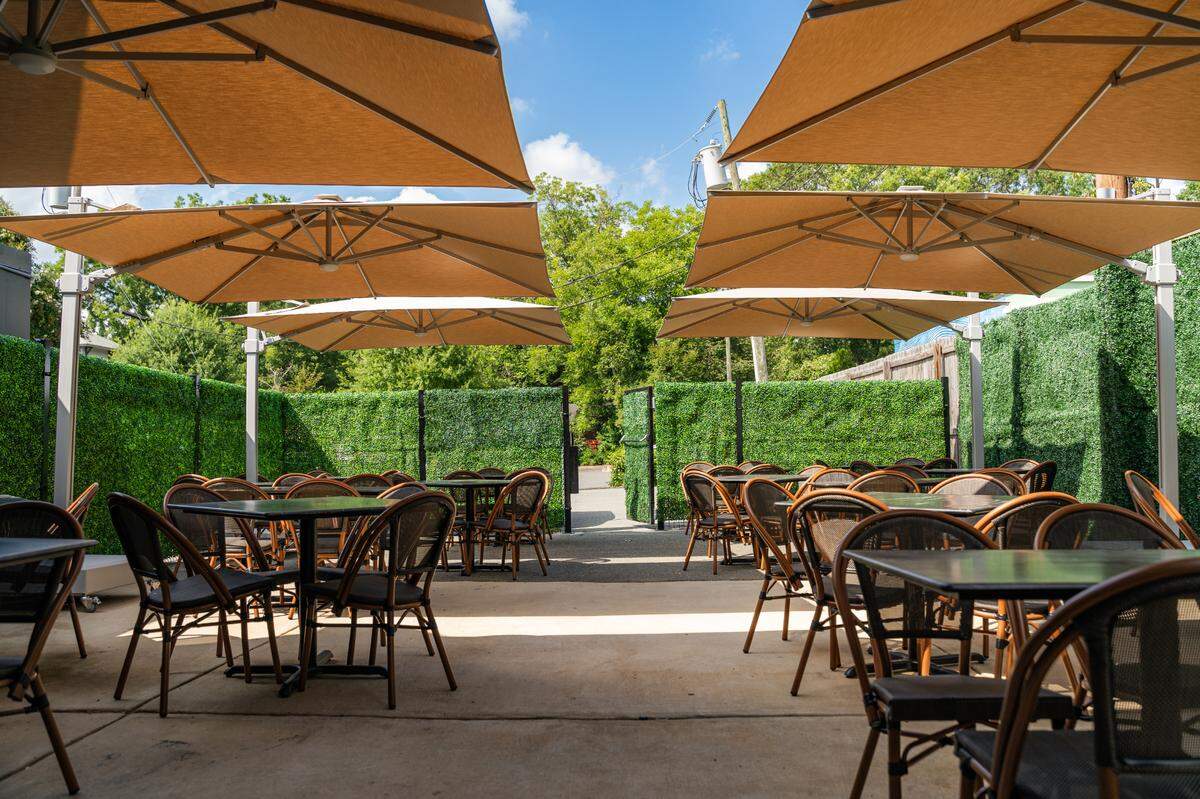 The outdoor garden patio at Dilworth Tasting Room in Plaza Midwood.