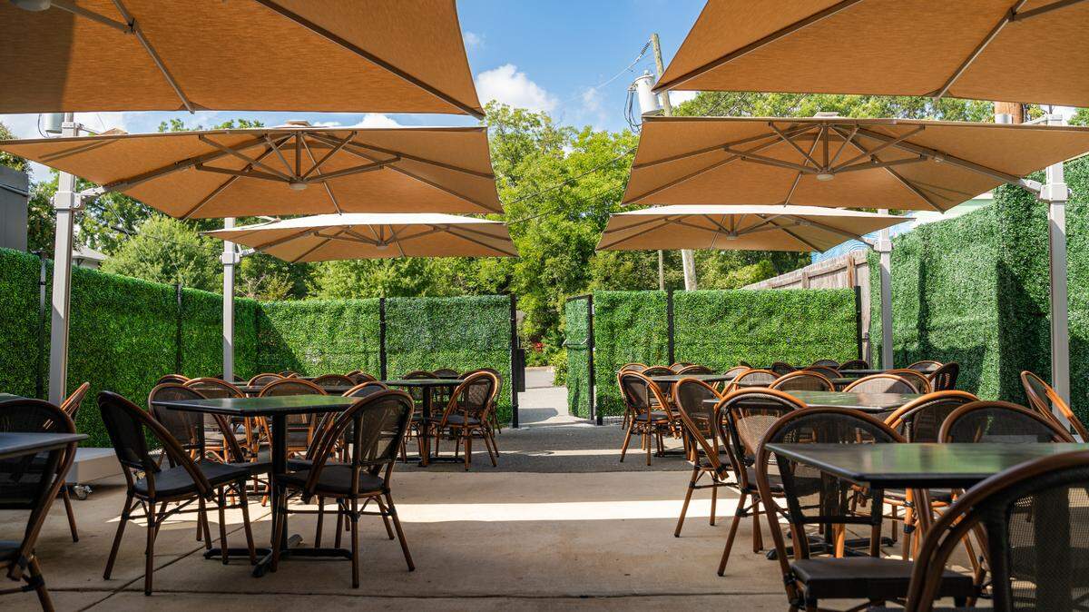 The outdoor garden patio at Dilworth Tasting Room in Plaza Midwood.