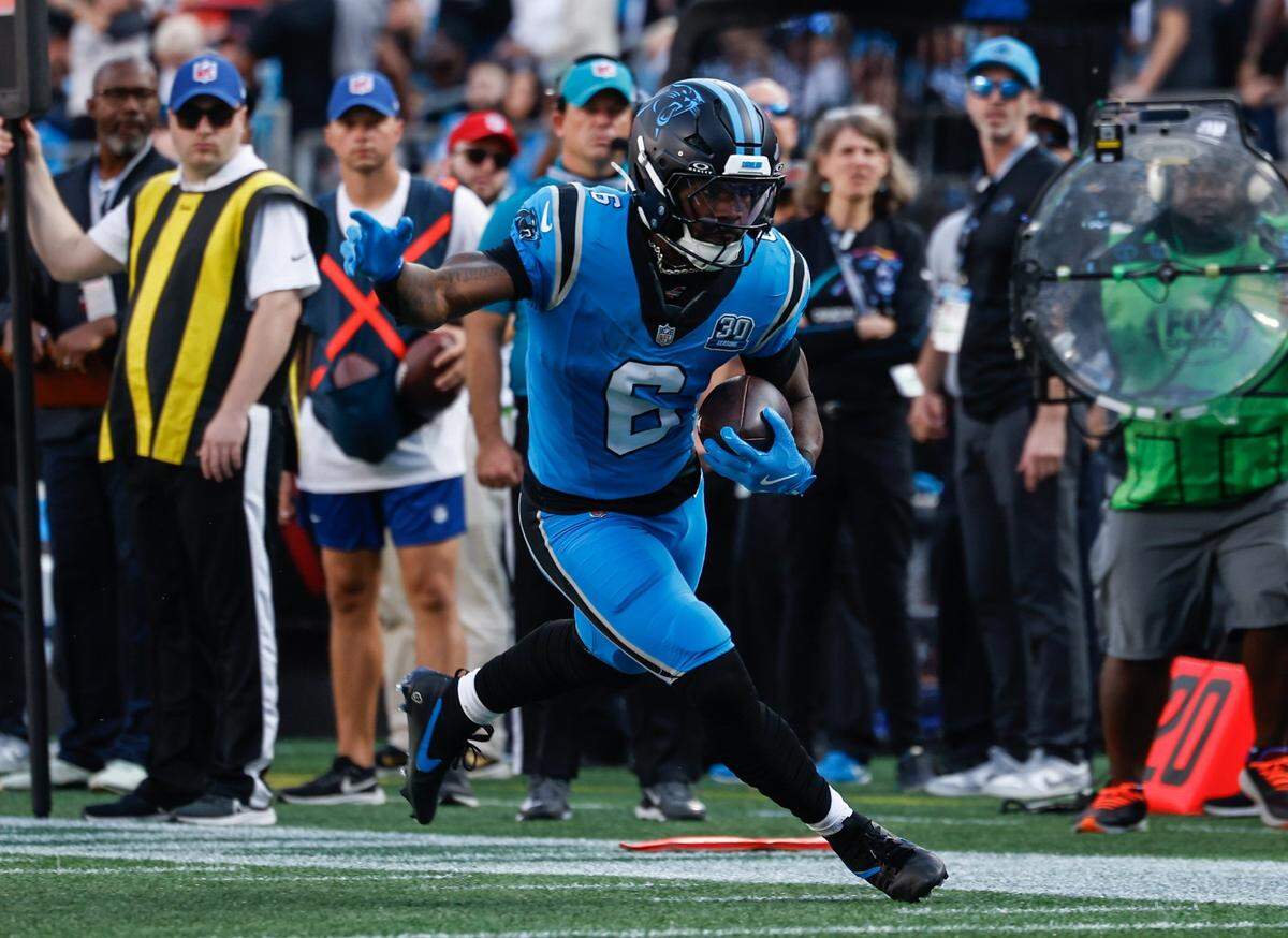 Panthers runningback Miles Sanders runs the ball during the game against the Falcons at Bank of America Stadium in Charlotte, NC on Sunday, Oct. 13, 2024.