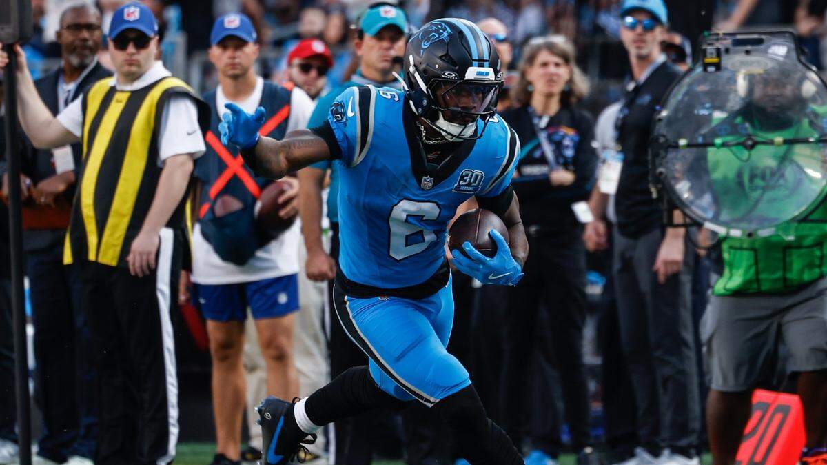 Panthers runningback Miles Sanders runs the ball during the game against the Falcons at Bank of America Stadium in Charlotte, NC on Sunday, Oct. 13, 2024.