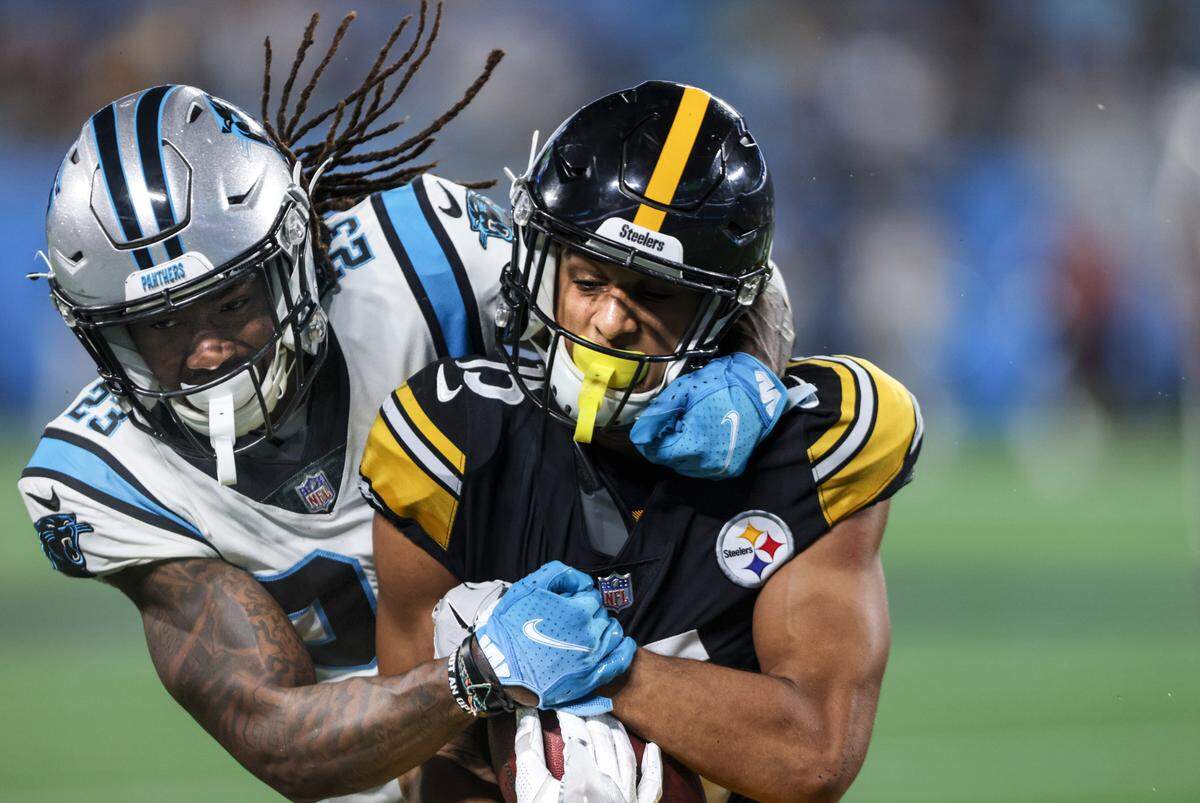 Carolina Panthers Stantley Thomas-Oliver, left, tackles Pittsburgh Steelers Cody White at the Bank of America Stadium in Charlotte, N.C., on Friday, August 27, 2021.