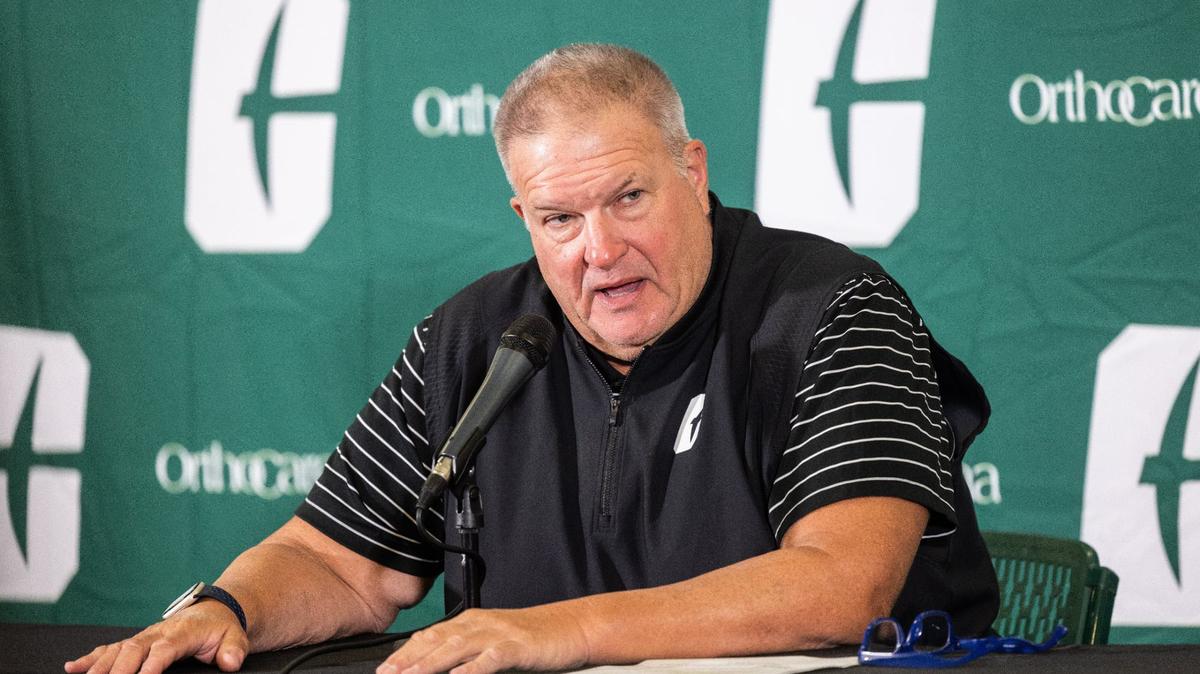 Charlotte 49ers coach Biff Poggi speaks during media day for the Charlotte 49ers football program on Tuesday.