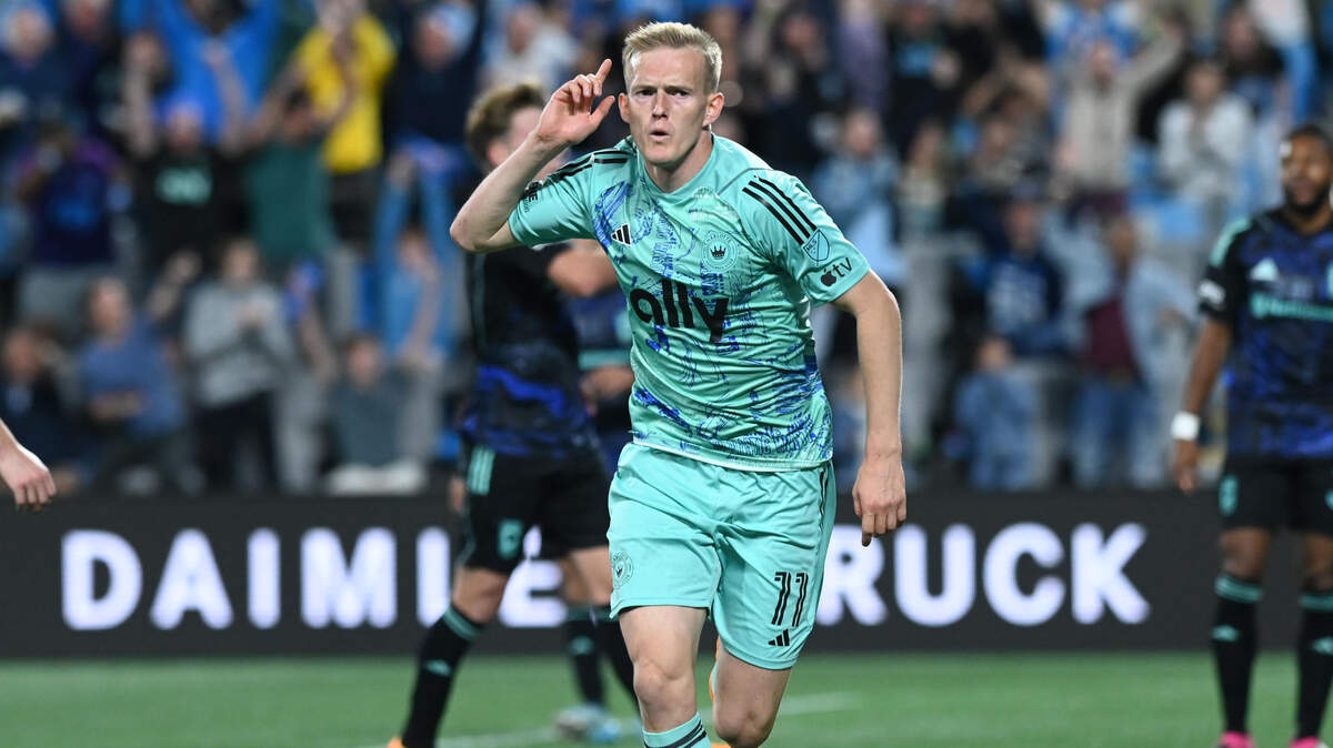 Charlotte FC attacker Karol Swiderski (11) celebrates after scoring a goal against Columbus Crew in the first half at Bank of America Stadium.