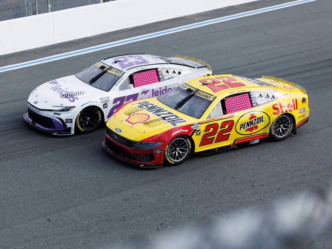 Joey Lagano (#22) passes Bubba Wallace (#23) during mid race action at the Bank of America Roval 400 on Sunday, Oct. 5, 2025, at Charlotte Motor Speedway.