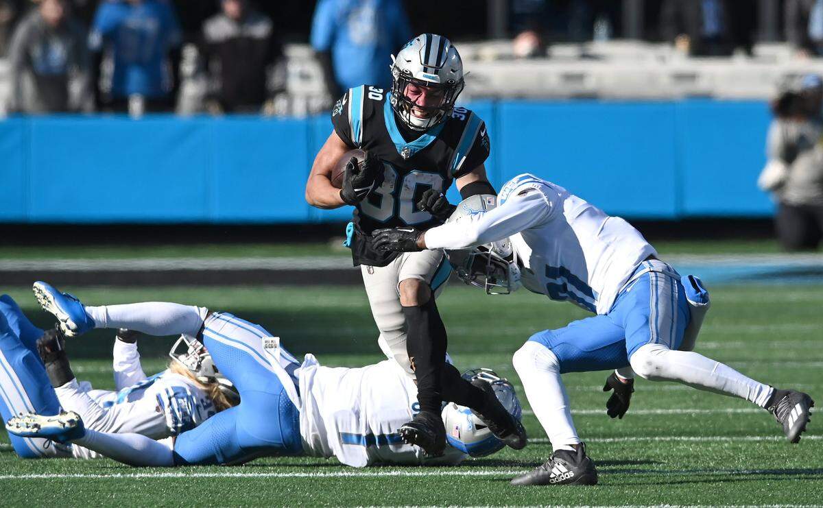 Carolina Panthers running back Chuba Hubbard rushes up the middle during second quarter action against the Detroit Lions at Bank of America Stadium on Saturday, December 24, 2022 in Charlotte, NC.