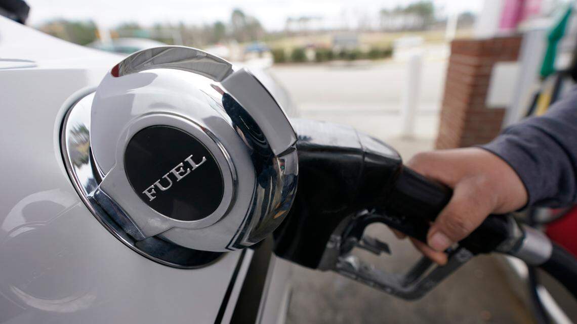 A customer pumps gas at a station in Richmond, Va., Tuesday, March 16, 2021. Experts say drivers in the Southeast could see higher gas prices if the Colonial Pipeline shutdown continues.
